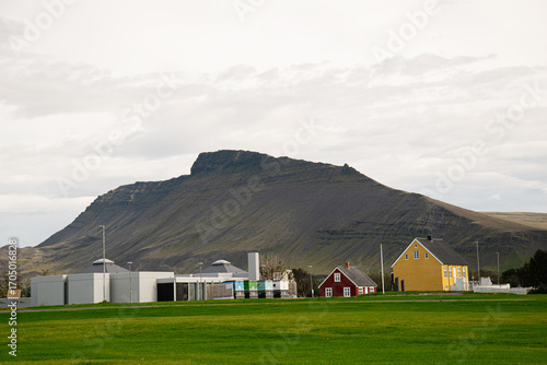 Traditional houses near mountain in Akranes Iceland with natural scenic landscape