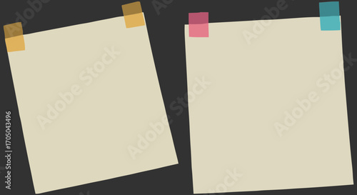 A pair of empty cream-colored sticky notes held by transparent tape on a charcoal grey surface, providing ample copy space for text and design elements