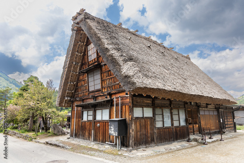 Typical traditional thick gassho zukuri style roof in Shirakawago in Central Japan during springtime.