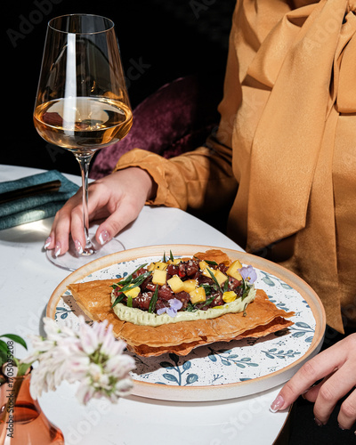 Enjoy an Elegant Dining Experience with a Gourmet Dish Accompanied