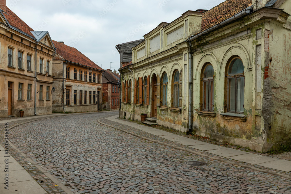 Fototapeta premium Forgotten vintage residential street. Kuldiga, Latvia.