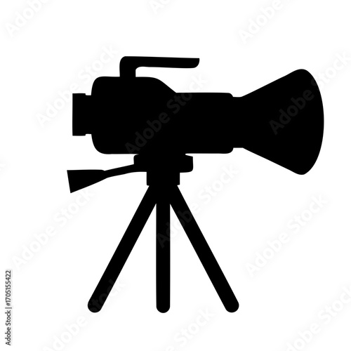 Silhouette of a vintage video camera on a tripod for filmography