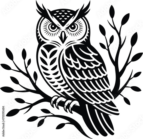 Black and white owl perched on a branch with leaves 1