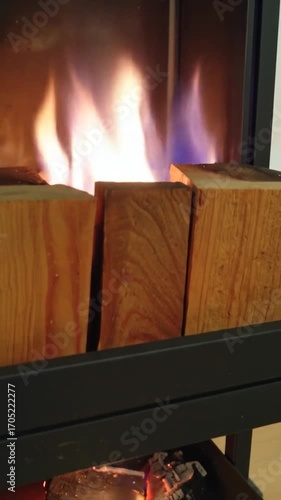 Fireplace flames consuming logs