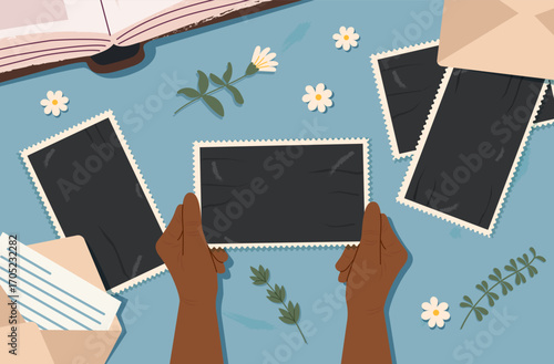 Human hands holding an old photo. Vintage and old photos cliparts. Concept of memories and aging. Vector flat banner.
