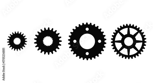 Four interlocking gears in a silhouette arrangement