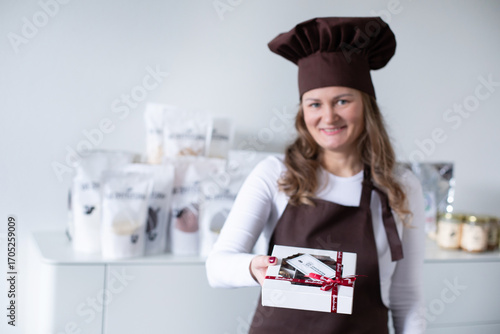 Chocolatier with homemade handmade boxes of chocolate