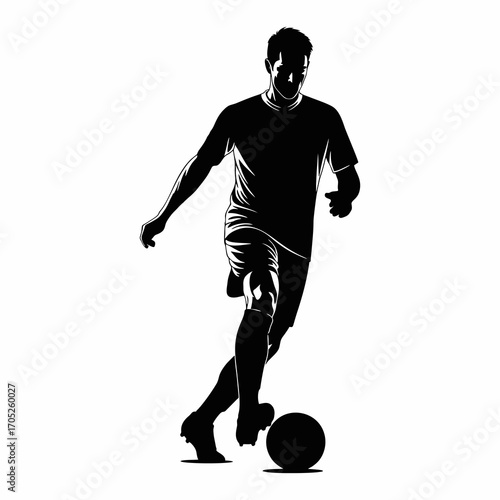 The silhouette of a soccer player dribbling the ball