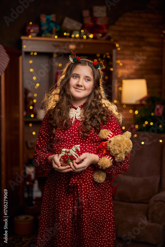 Smiling Girl in Red Dress with Christmas Decor