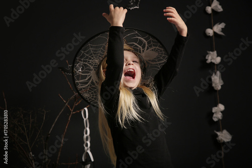 Cute little girl studio Halloween photoshoot 