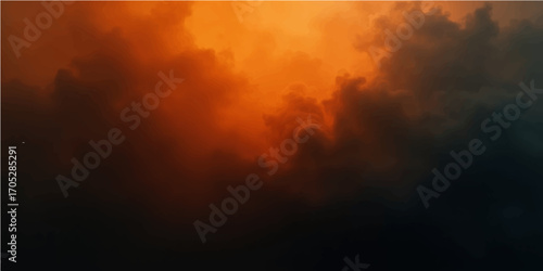 Abstract dramatic dark storm clouds and fire in the sky at sunset