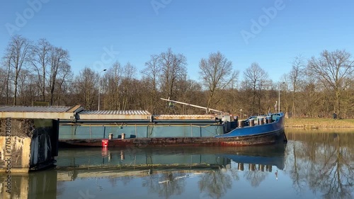  A barge on a water canal near the city of Herstel in Germany