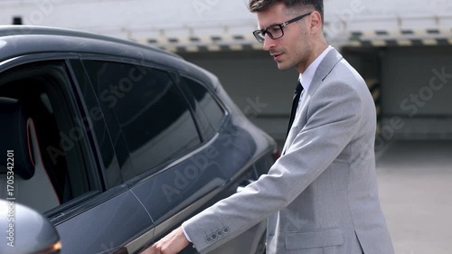 Wallpaper Mural A man in a suit is getting into a car Torontodigital.ca