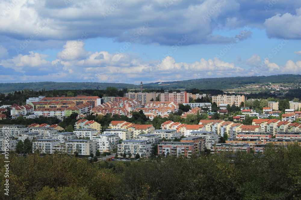 Naklejka premium Panoramic Landscape of Brno, Czech Republic City View with Fields, Mountains, and Fluffy Clouds