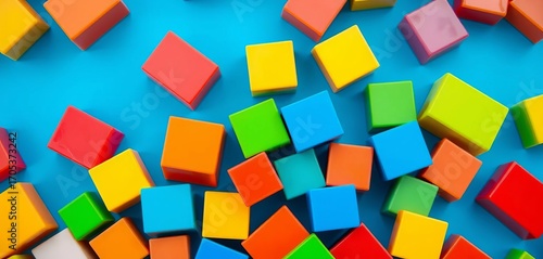 Vibrant plastic blocks closeup on blue background,  building blocks,   educational toys