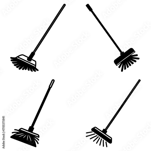 Four black brooms with long handles and different bristle styles arranged on a white background space design
