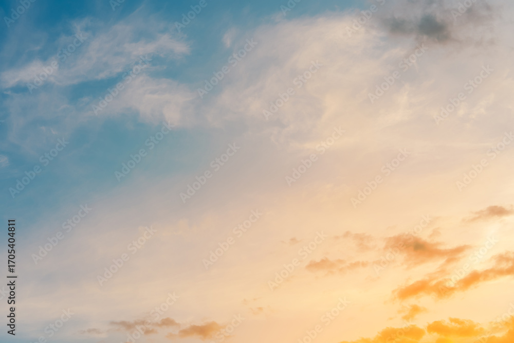 Fototapeta premium Sunset sky background.Autumn sunrise with cloud on yellow,blue over beach,Landscape summer evening and nature sunlight,Horizon banner sunny in Winter morning,Beautiful cinematic cloudy and dusk sky