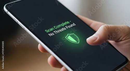 Scan complete on smartphone with no threats found and security shield icon