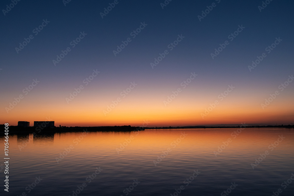 Obraz premium sunset over the river