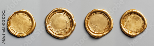 Row of four antique gold wax seals aligned on neutral gray studio background. AI generated