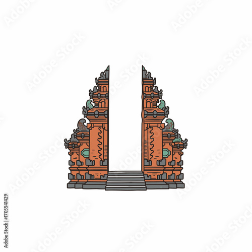 Ornate Balinese gate with steps, featuring detailed carvings and a symmetrical design.