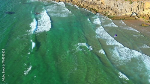 Aerial view from a kitesurfer riding at waves at Guincho beach,Cascais,Portugal