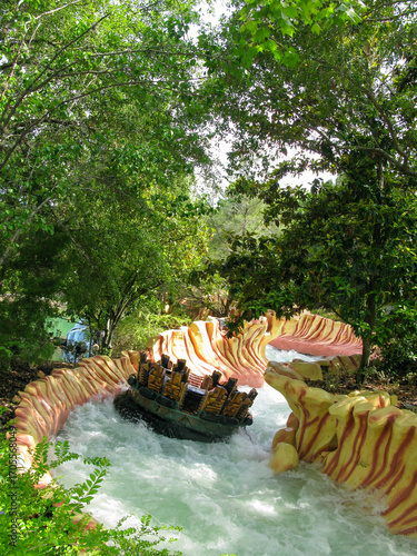 Fotografie The rapids on a thrilling water ride at a theme park, seeking adventure and a splash of fun