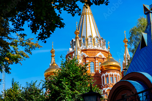 A majestic temple with golden domes, a symbol of the spirituality and history of the city, built in the Russian style.