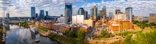 Nashville skyline at sunrise with river and modern skyscrapers