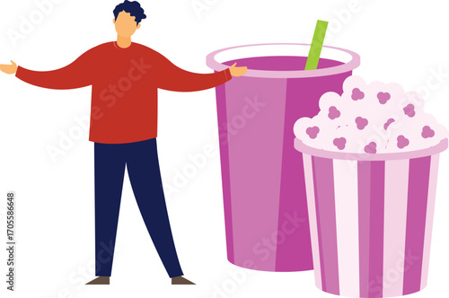 boy is enjoying popcorn with juice