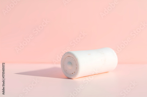 Rolled White Towel on Pink Surface - Minimalist Spa Concept