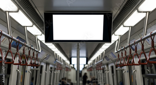 Interior view of subway train car with white screen overhead handles and lights