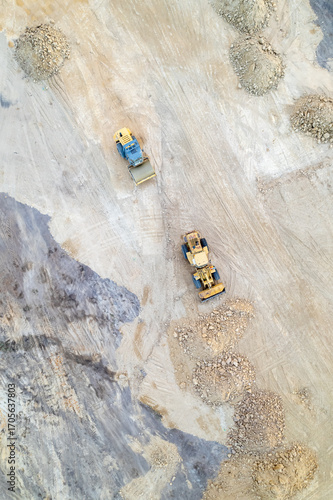 A vertical top down aerial view of a construction site with heavy machinery The Power of the Construction Industry