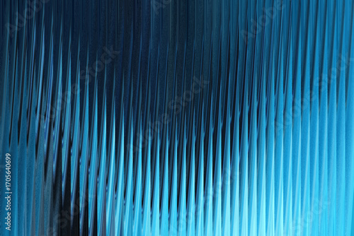 Photography A closeup abstract view of textured blue glass with vertical ridges, creating a