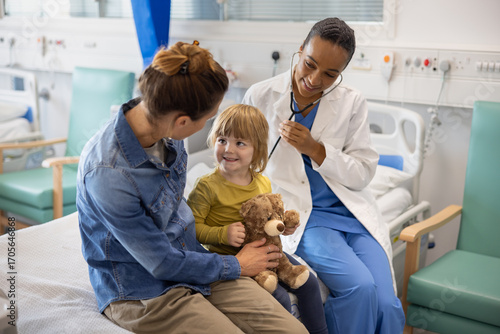Child with Teddy Bear at Hospital Checkup Visit