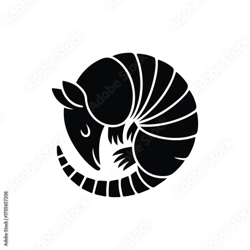 Black and white armadillo curled up with protective armor in circular decorative design