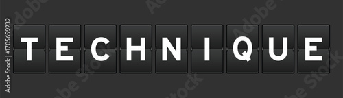Black color analog flip board with word technique on gray background
