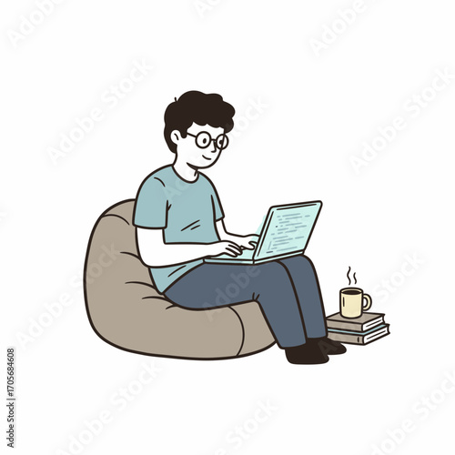 Young man comfortably works on laptop, relaxed in beanbag chair with coffee and books nearby.