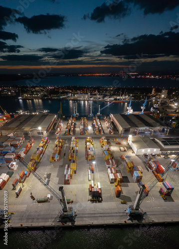 Aerial view to a container unloading terminal of port of Burgas, Bulgaria at night. Logistics and transport