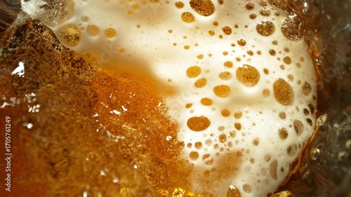 Super Slow Motion of Pouring Beer into Pint Glass, Top Down View, Rotating Camera Move. Filmed on High Speed Cinema Camera, 1000 fps.