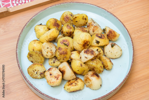 Navratri vrat food jeera aloo ki sabji that is ghee roasted cumin potato in blue plate. Hindu upvas or fasting item.
