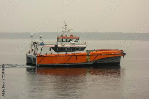 Modern Catamaran Vessel Sailing on Calm Sea. Offshore Transport, Marine Engineering, Maritime Industry, Coastal Travel, Shipping, and Nautical Navigation Concept