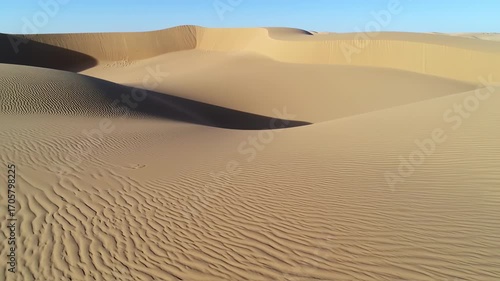 Desert dunes under a clear sky