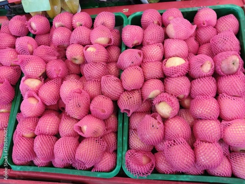 piles of pears in supermarket display baskets, a bunch of pears sold in stores, fresh pears in store baskets