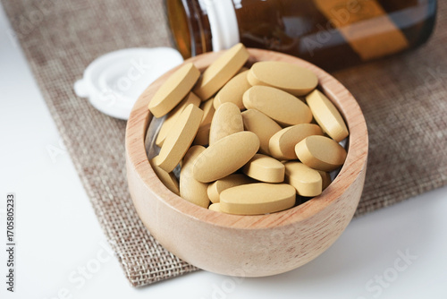 close up of Vitamin C pill. Nutritional supplement, healthy lifestyle background.
