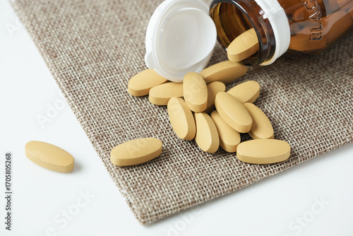 close up of Vitamin C pill. Nutritional supplement, healthy lifestyle background.
