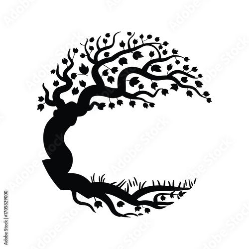 Mysterious silhouetted tree with winding branches and sparse grass detail isolated
