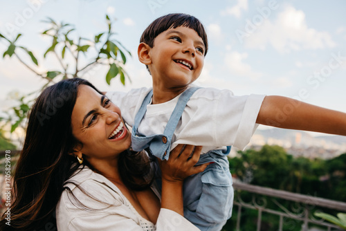 Quadro su tela Mother and son enjoying playful moment together outdoors on a sunny day