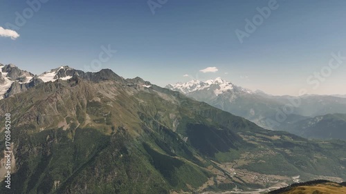 Majestic Snow Capped Mount Shkhara Dominates the Landscape of the Caucasus Mountains in Georgia, Creating a Breathtaking View Against a Vibrant Blue Sky
