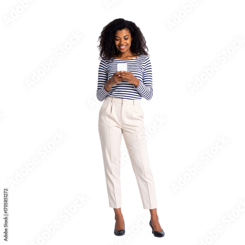 A beautiful young woman is smiling while holding and texting on a tablet and a cell phone